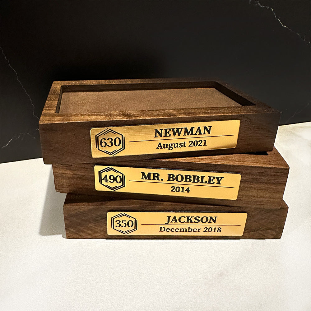 Three Cruise Milestone crystal block bases stacked on top of each other.