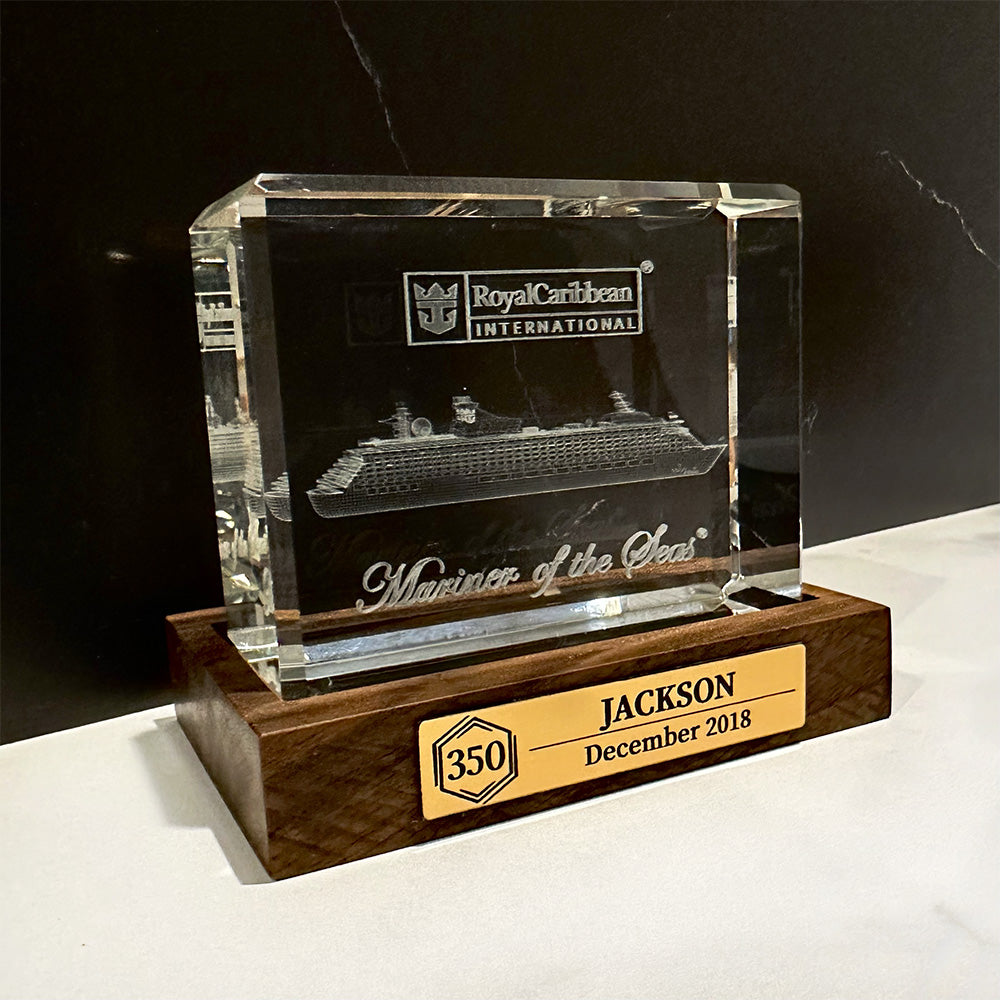 A Cruise Milestone crystal block base with a ship on it.