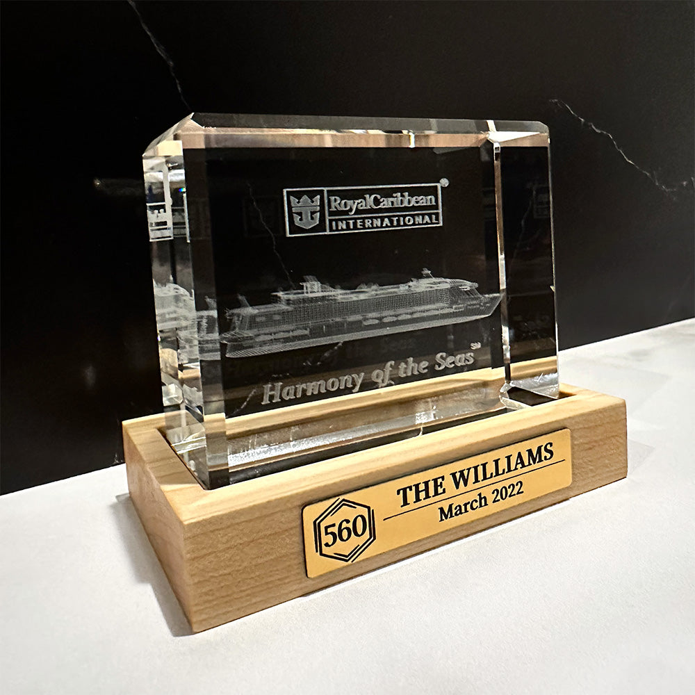 A Cruise Milestone crystal block base with the name williams on it.