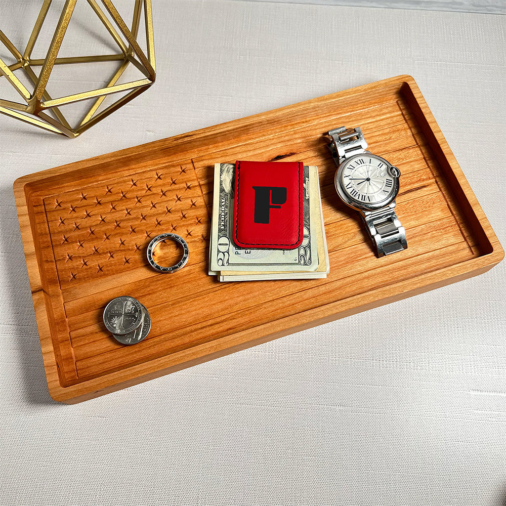A USA Flag wood tray with a watch and a watch.
