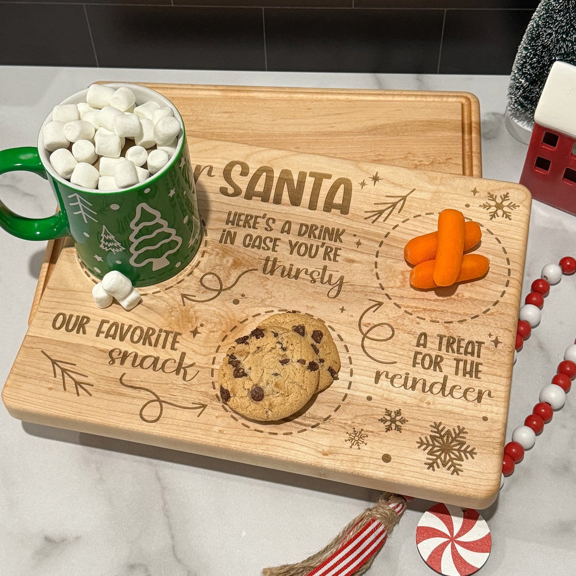 A wooden Santa Tray / Cutting Board with a santa mug and cookies.