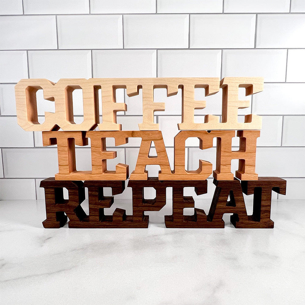 A wooden sign that says Standing words - Coffee Teach Repeat.