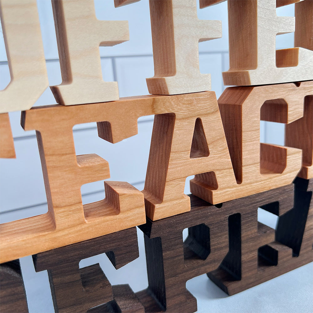 A set of wooden letters that say 'Standing words - Coffee Teach Repeat'.