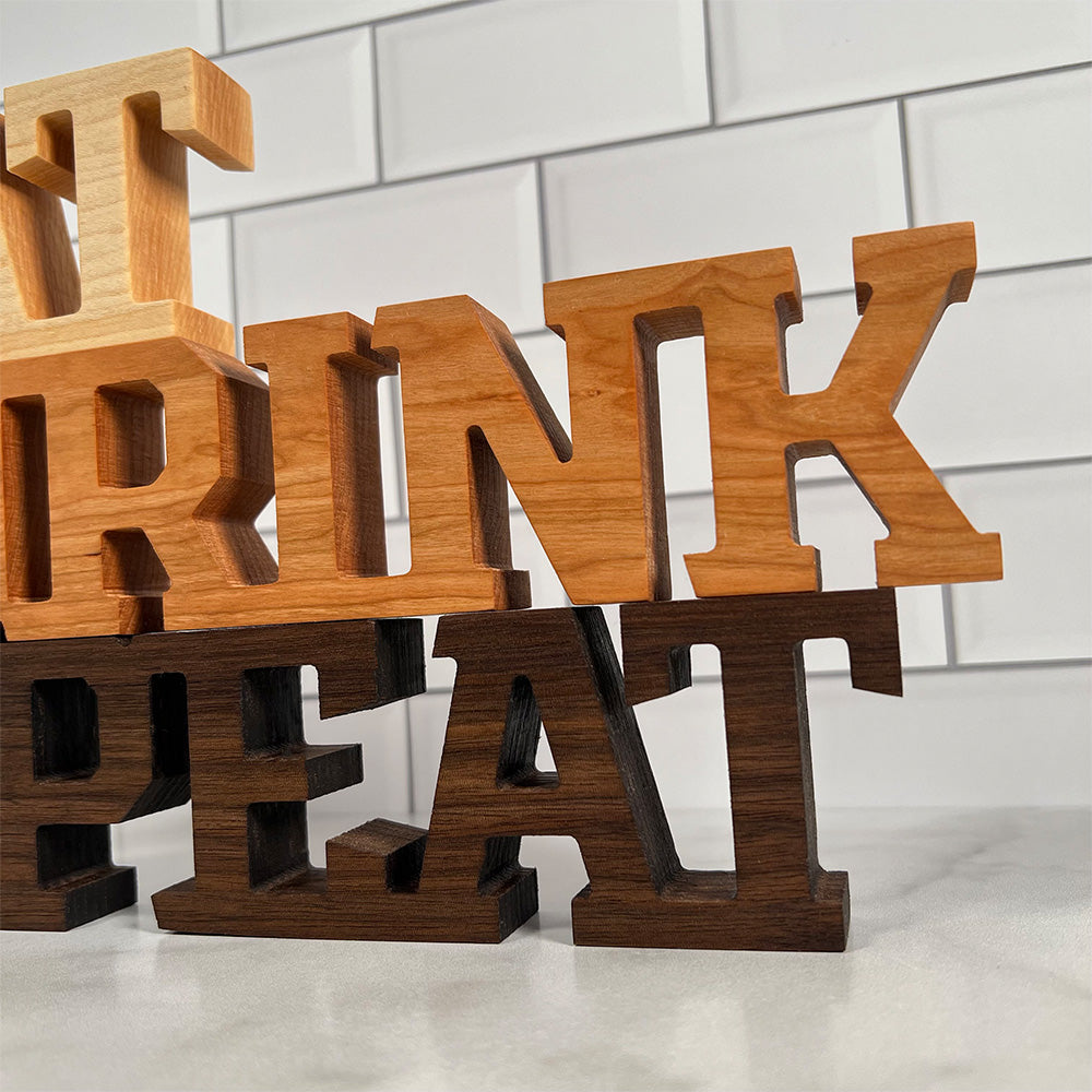 Standing words - Eat Drink Repeat wooden letters.