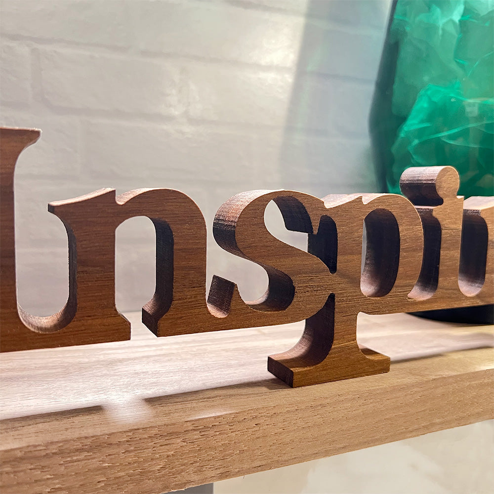 A standing word - INSPIRE with the word inspire on it.