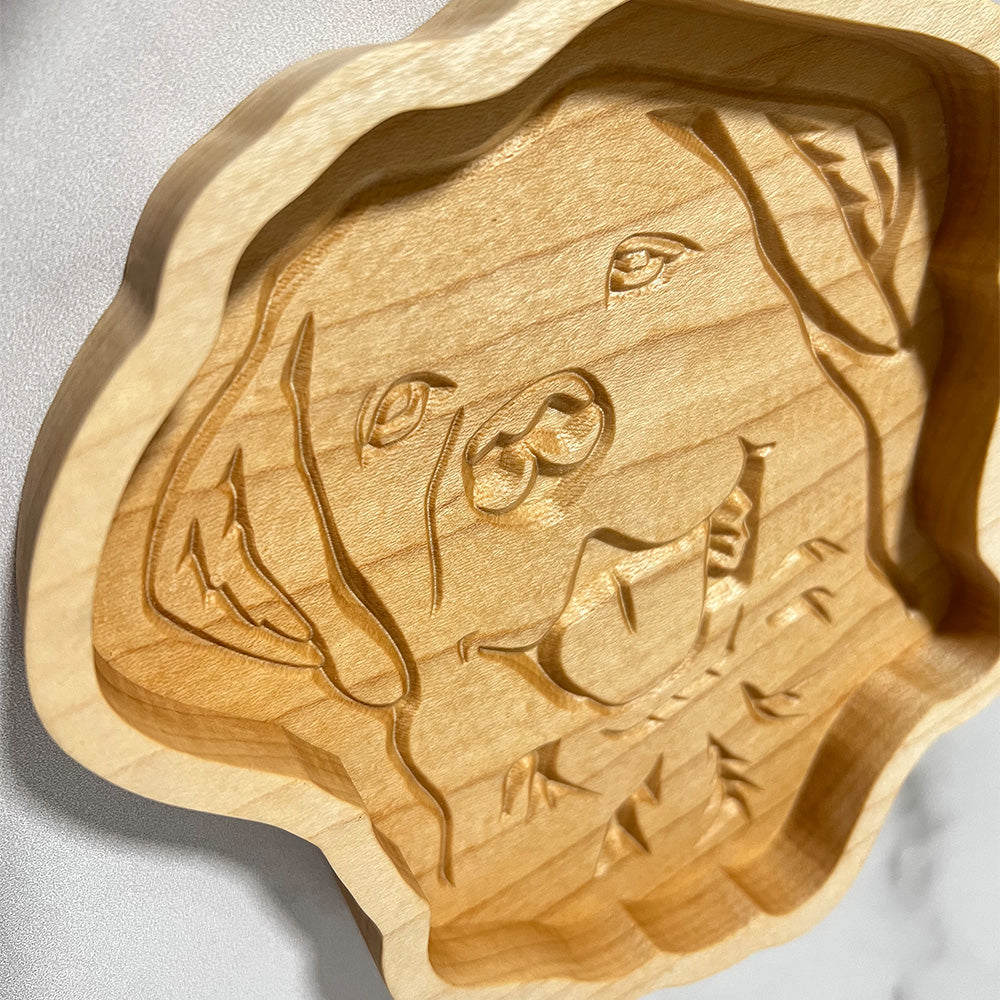 A Labrador wood tray with a dog carved on it.