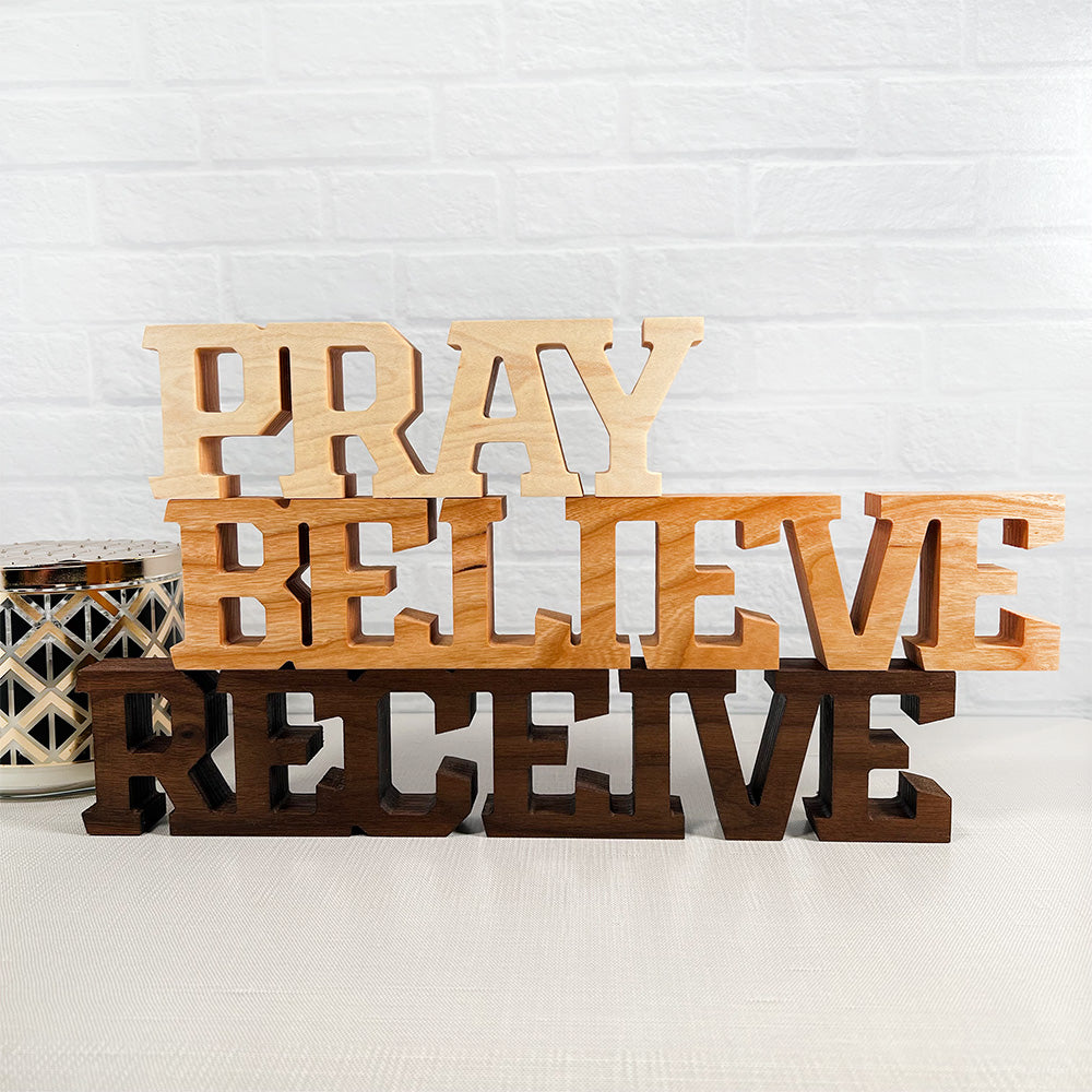 Standing words - Pray Believe Receive wooden letters.