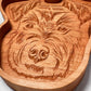 A Schnauzer wood tray with a dog engraved on it.