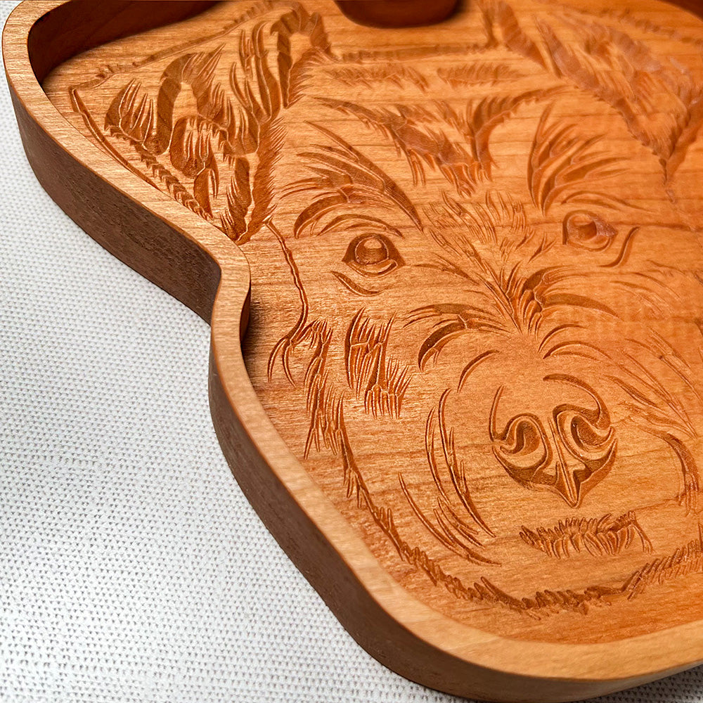 A Schnauzer wood tray with a dog on it.