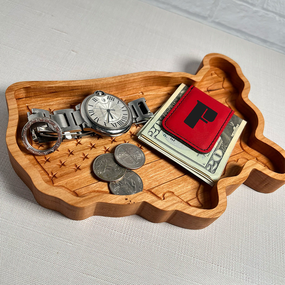 A USA Map & Flag wood tray with money, a watch, and a watch.