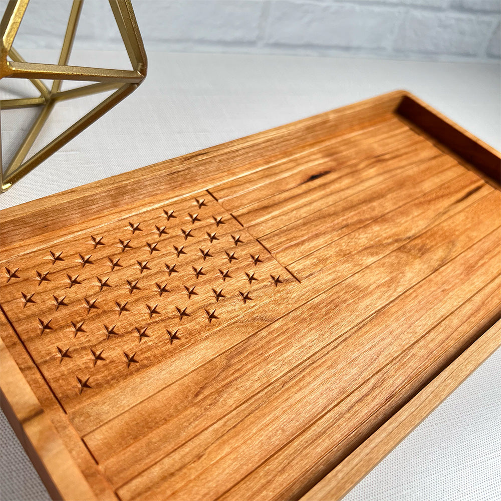 A wooden tray with a USA Flag wood tray on it.